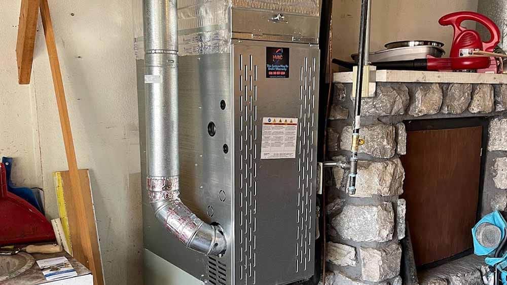 Technician inspecting a heating system Tulsa, OK Technician inspecting a heating system Tulsa, OK