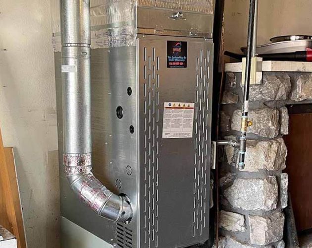 Technician inspecting a heating system Tulsa, OK