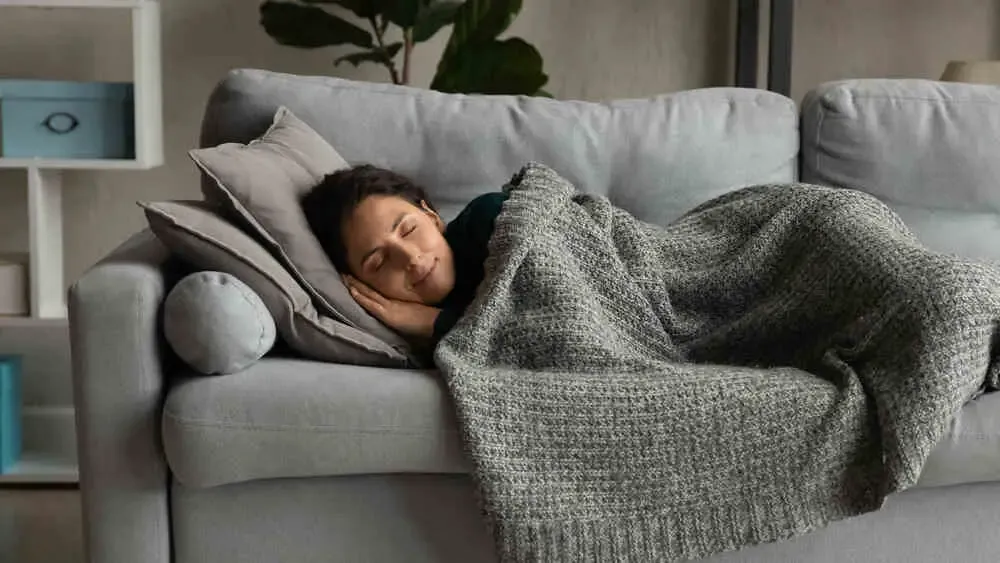 Person bundled up in blankets (for warmth) Person bundled up in blankets (for warmth)