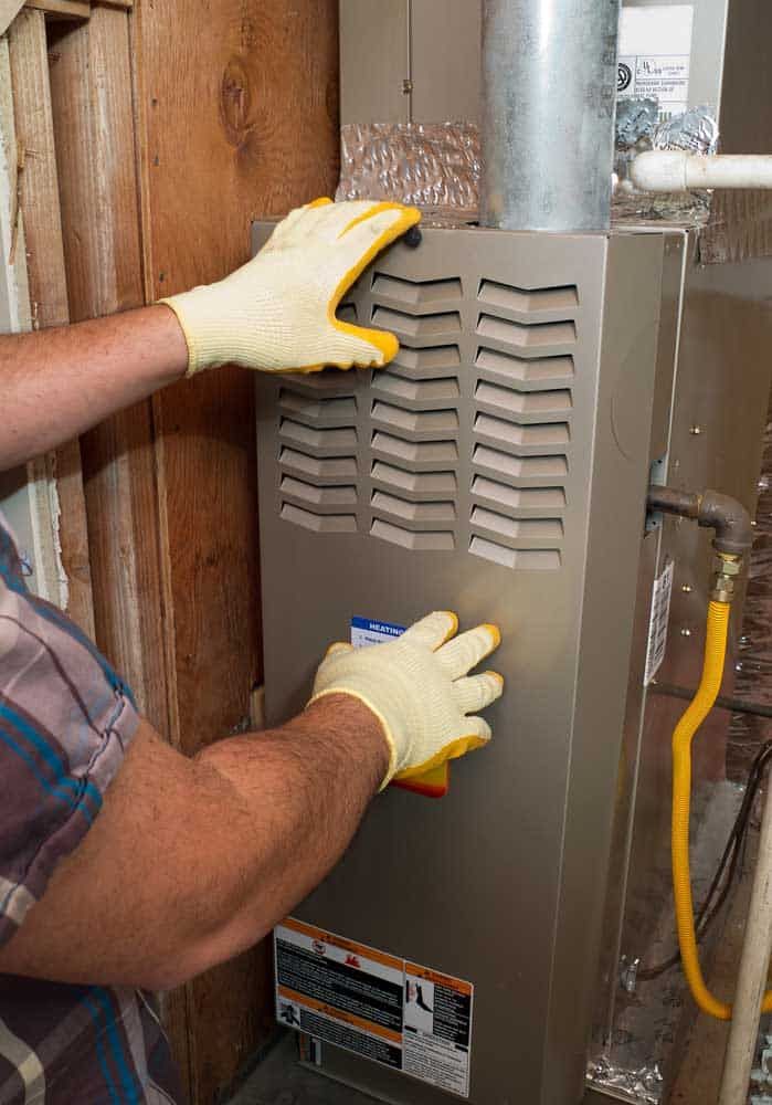 technician repairing heating system Broken Arrow, OK technician repairing heating system Broken Arrow, OK
