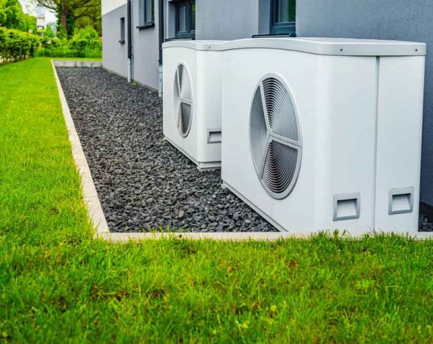 Two air source heat pumps installed outside Tulsa, OK