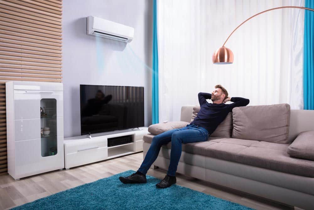 Person enjoying the breeze from an AC vent Person enjoying the breeze from an AC vent