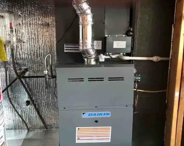 Inspecting a heating system’s components Broken Arrow, OK